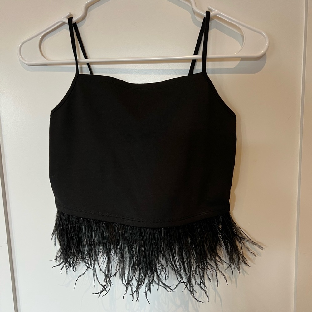 NWT Urban Outfitters feather hemmed top.